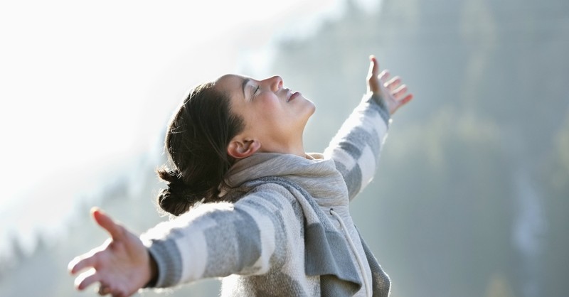 woman praising, rejoice in the lord always