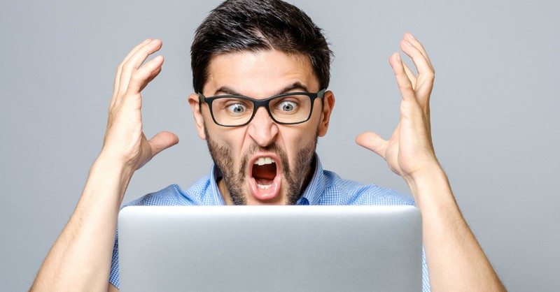 angry man shouting at computer screen, cancel culture