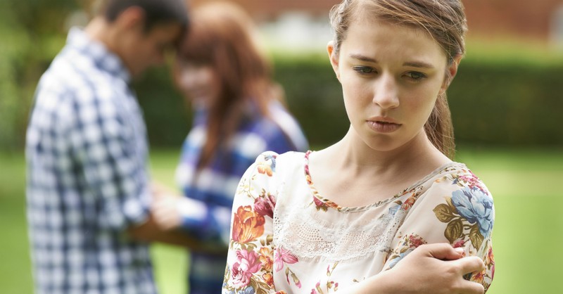 teen girl looking sad left out