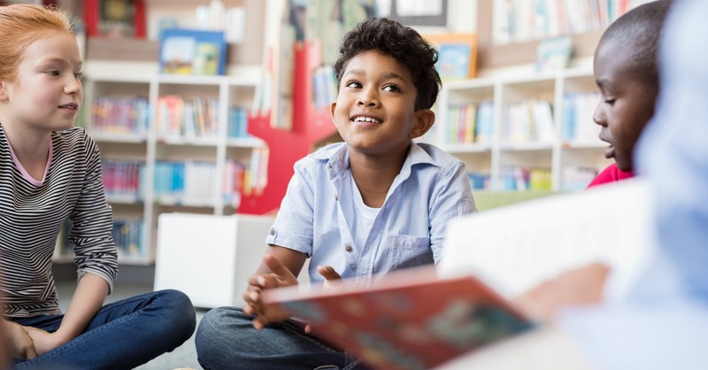 young elementary student sitting in classroom