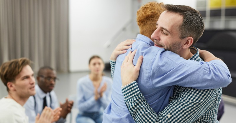 men in therapy forgiving each other