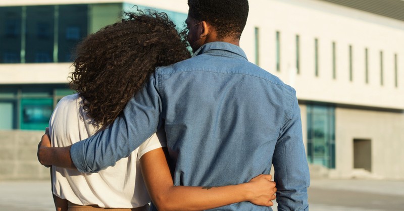 Back view of a man and woman hugging