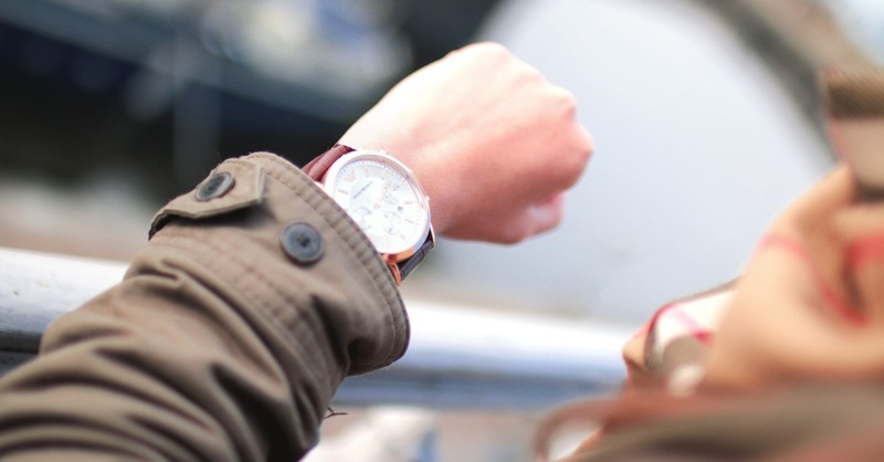 woman looking at watch