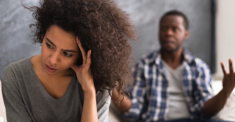 wife looking upset with husband arguing