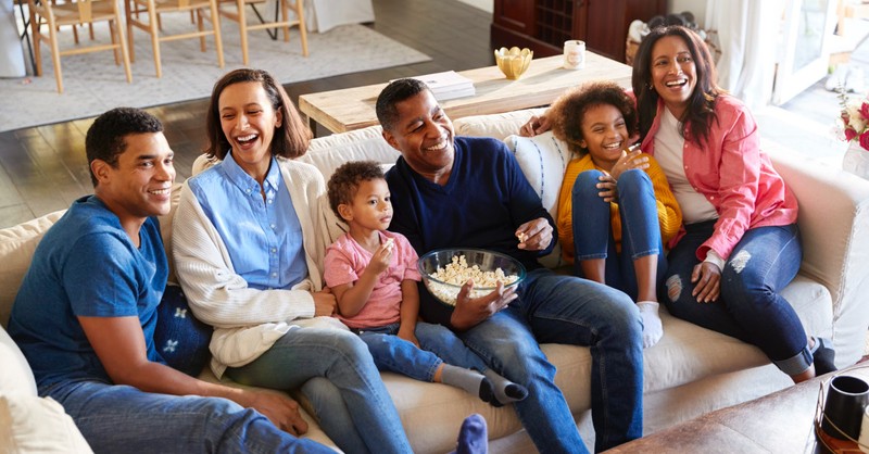 Family watching a movie together