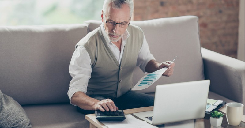 man working on computer at home