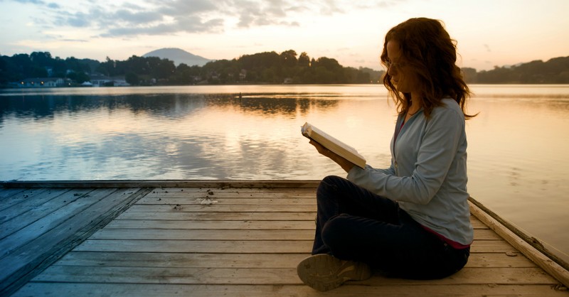 woman reading bible by a lake, change quiet time