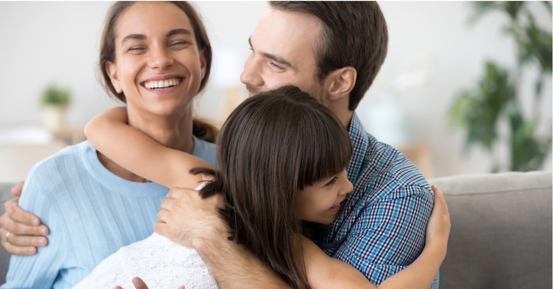 family hugging dad