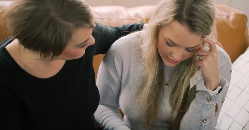 woman encouraging friend