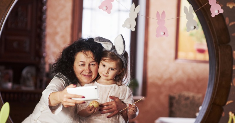 grandmother and granddaughter take an Easter picture together