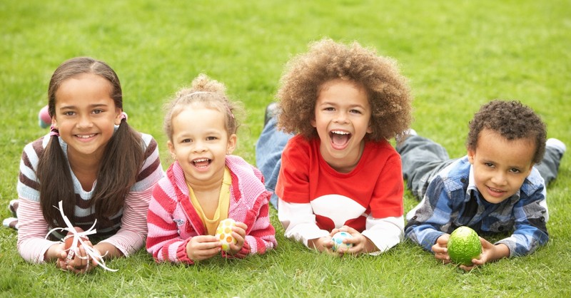 children laying on grass outside