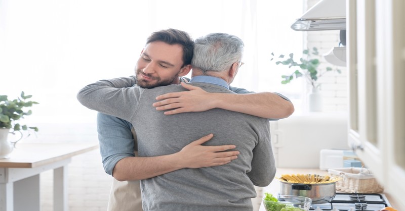 Father and son hugging, leave and cleave