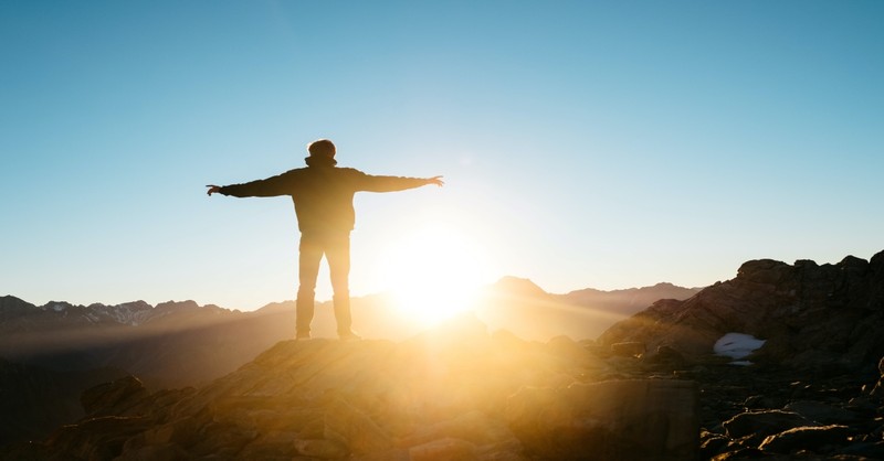 person standing on hill, perfect love casts out fear