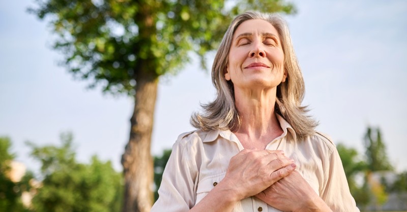 Woman praying outside