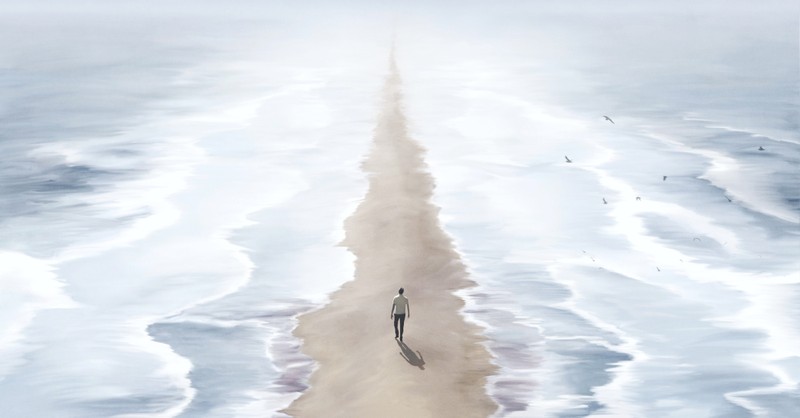 Man walking through the ocean