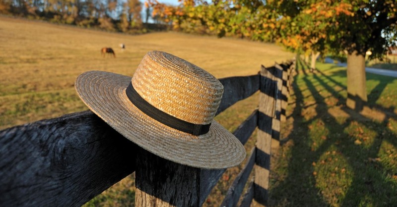 straw amish hat on Pennsylvania fence, beverly lewis