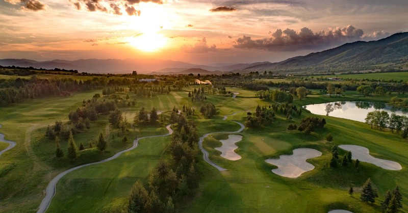 A golf course laid out at sunrise