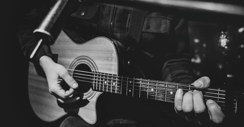 black and white photo of man playing guitar, randy matthews christian rock