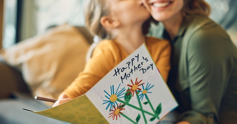 Mother and daughter with Mother's Day Card