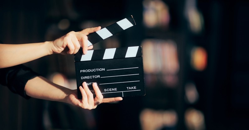 person holding clapper board