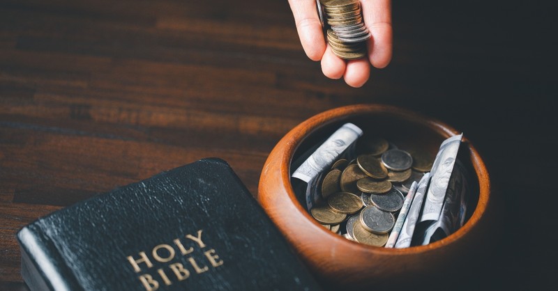 Money bowl near the Bible