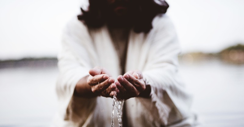 Jesus holding water