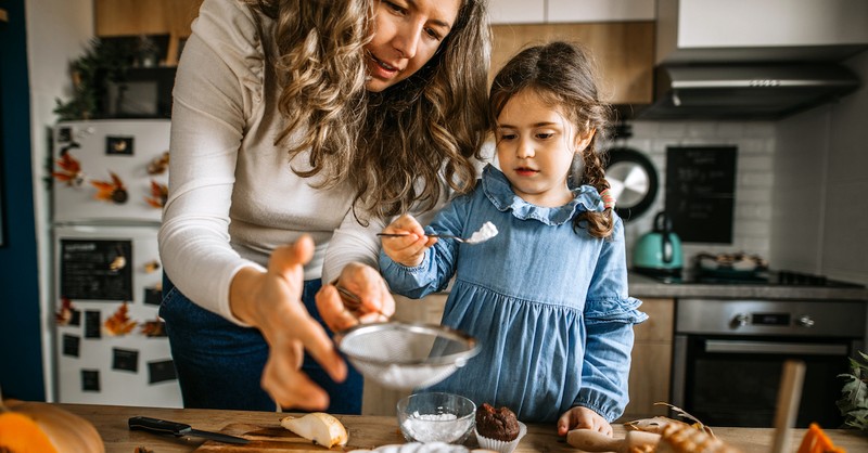 Mom and daughter baking during fall