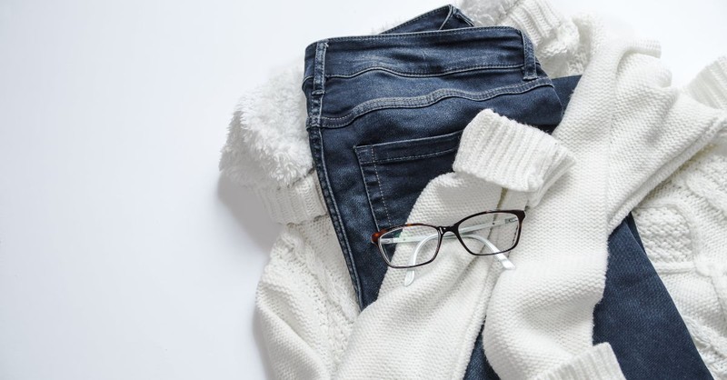 A pile of clothes and a pair of glasses