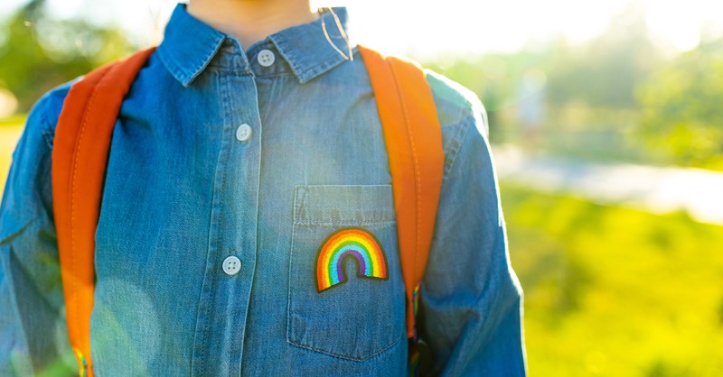 Transgender LGBTQ student with rainbow backpack gender identity