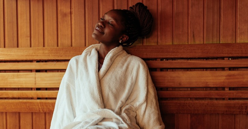 Peaceful woman relaxing at spa self care