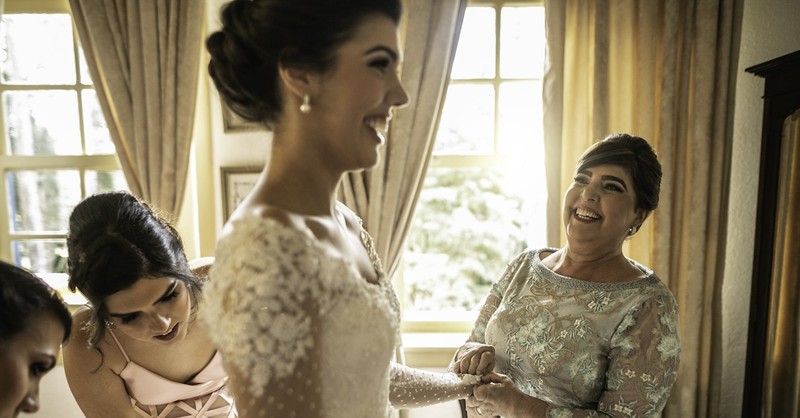 Mother with bride on wedding day leave and cleave adult children