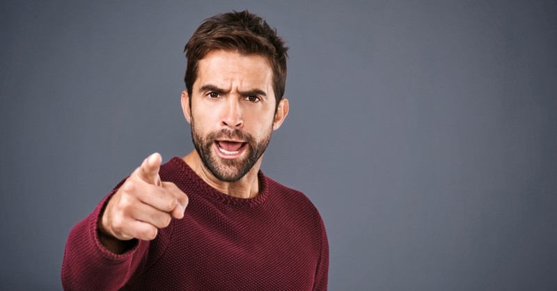 angry man shaking fist at camera