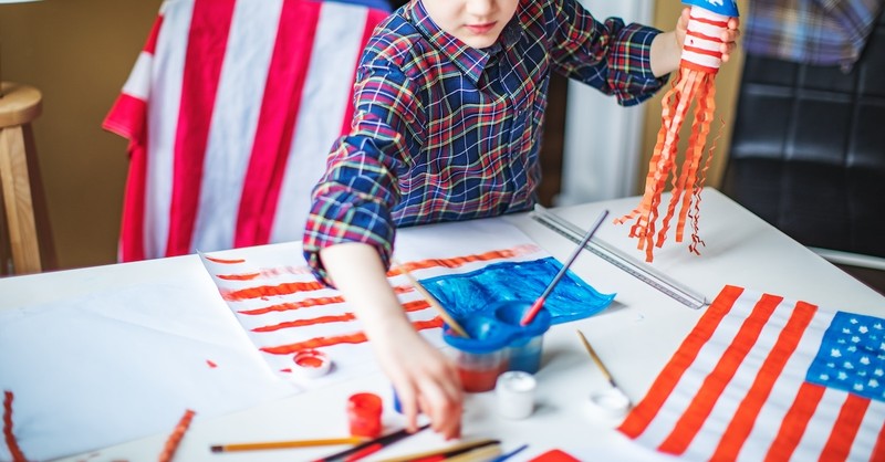 Boy doing patriotic craft Fourth of July Memorial Day painting American flag