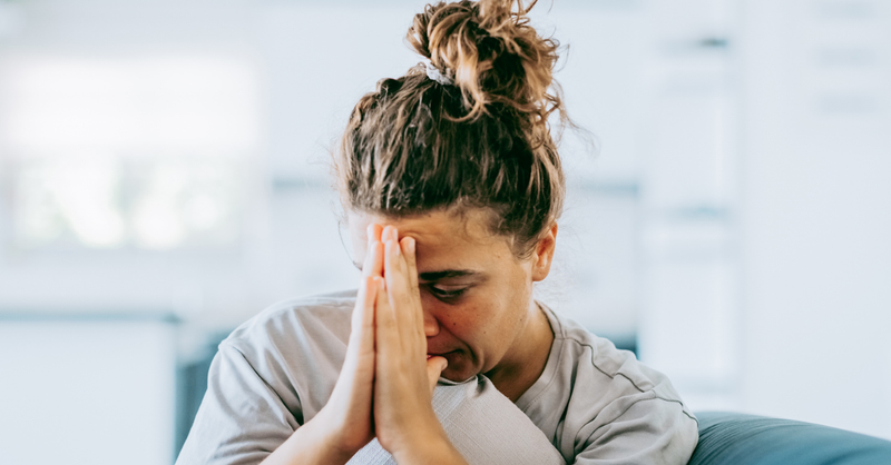 women crying out in frustration/prayer