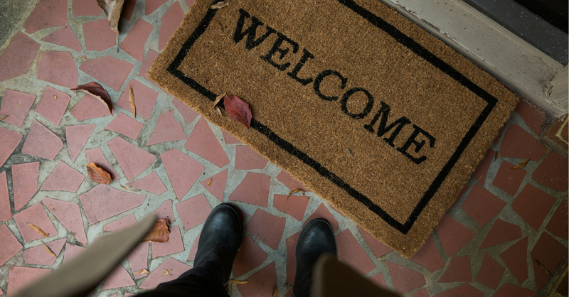 A welcome doormat at the entrance of a home symbolizes inviting God into every area of life, opening your heart to His presence, and embracing spiritual transformation.