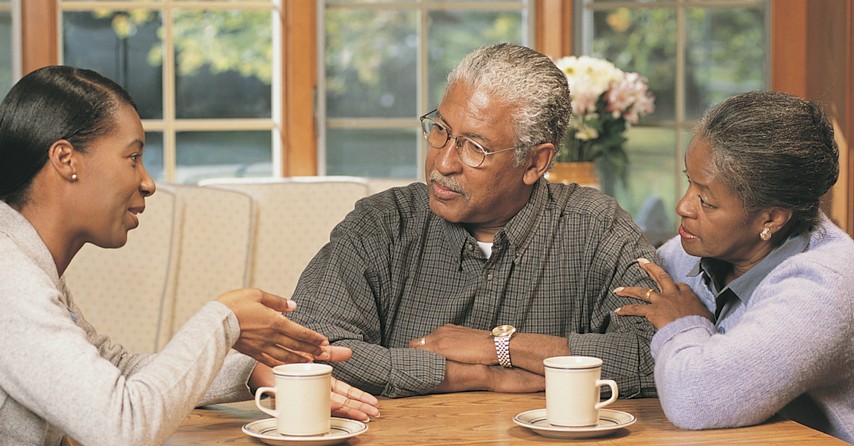 Daughter having coffee with her parents