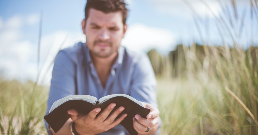 A man reading a Bible