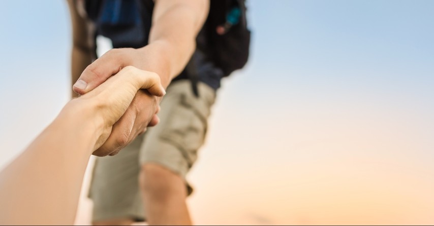 Man helping someone up, fruit of the spirit