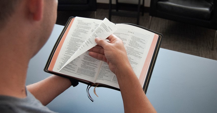 man reading the bible