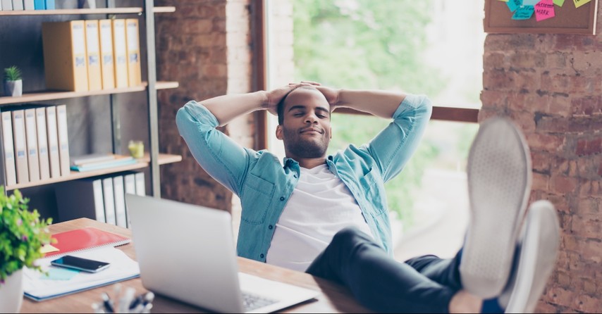 Man in an office reclining back