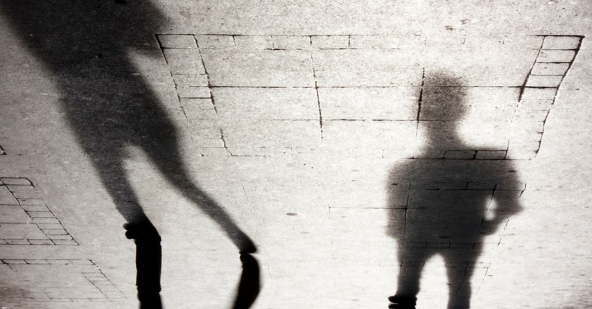 shadows of two unknown men walking to signify Two Witnesses in Revelation 11