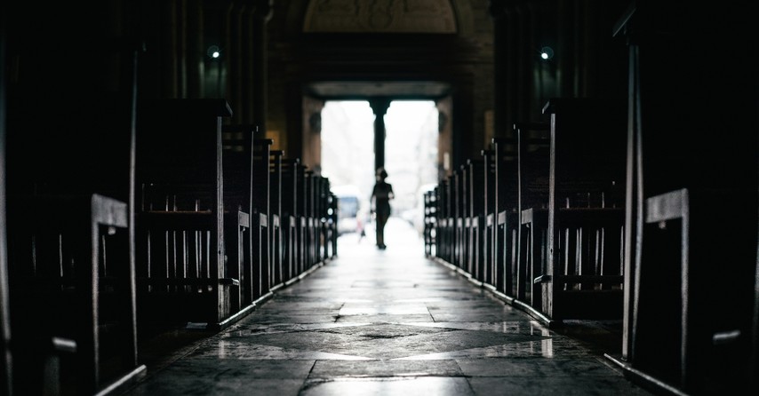 view down aisle of empty church and pews, warnings for christians asleep