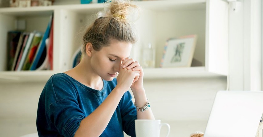 girl praying prayer pray stress overwhelmed working from home studying