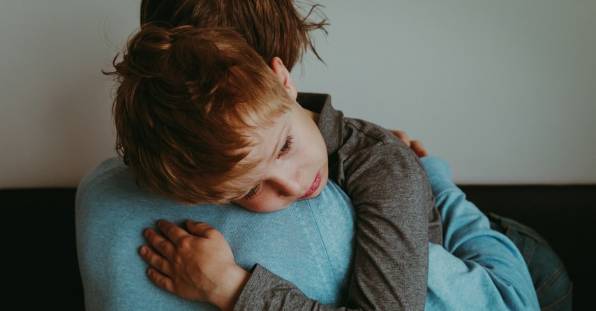 Parent comforting a sad/scared child