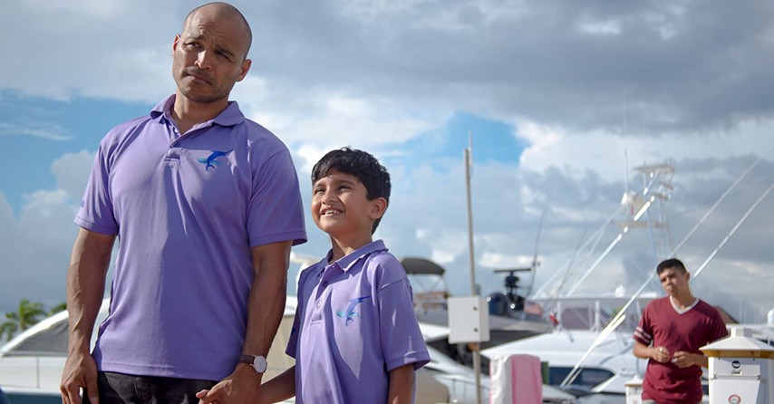 a man and little boy on a fishing dock, Blue Miracle