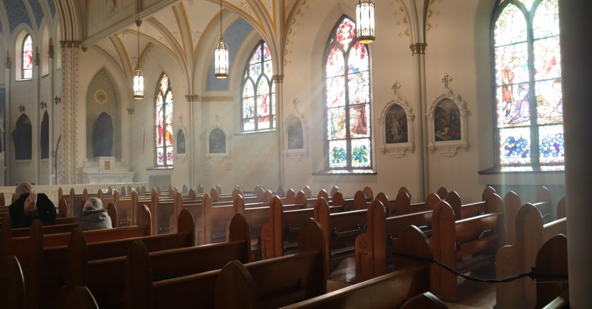 Inside of an old church with stained glass