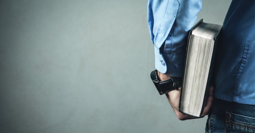 man holding a Bible