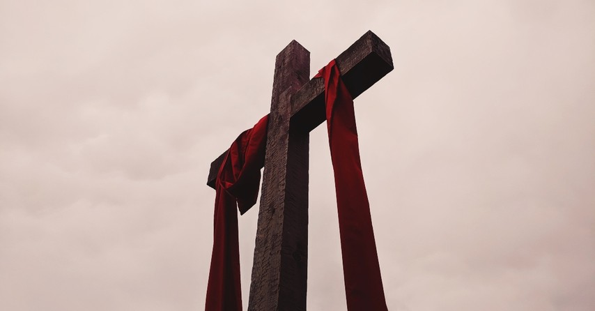 Cross with a red sash on it