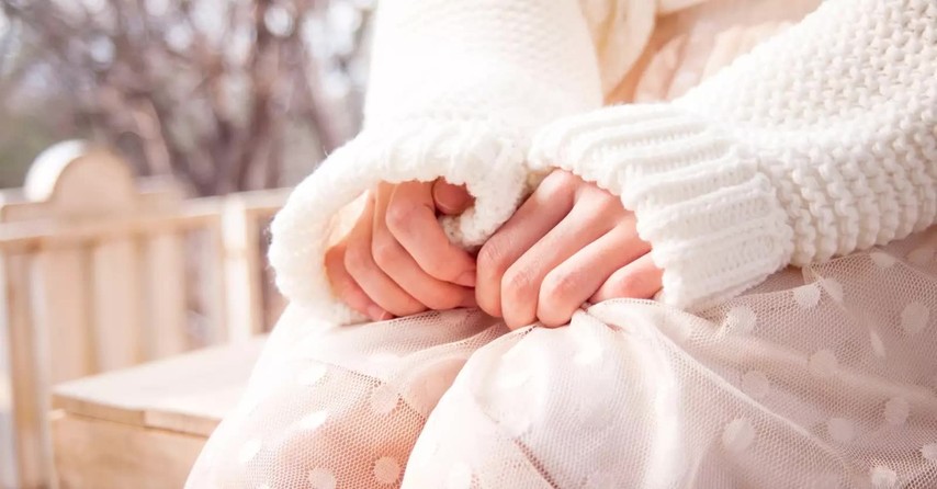 Close up of a worried woman's hands