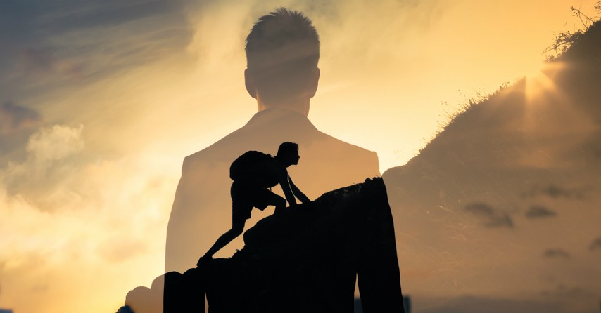 transparent back view of man seeing himself climbing up hill